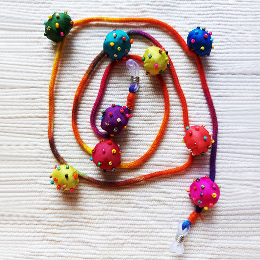 Silk beaded bauble spectacle string