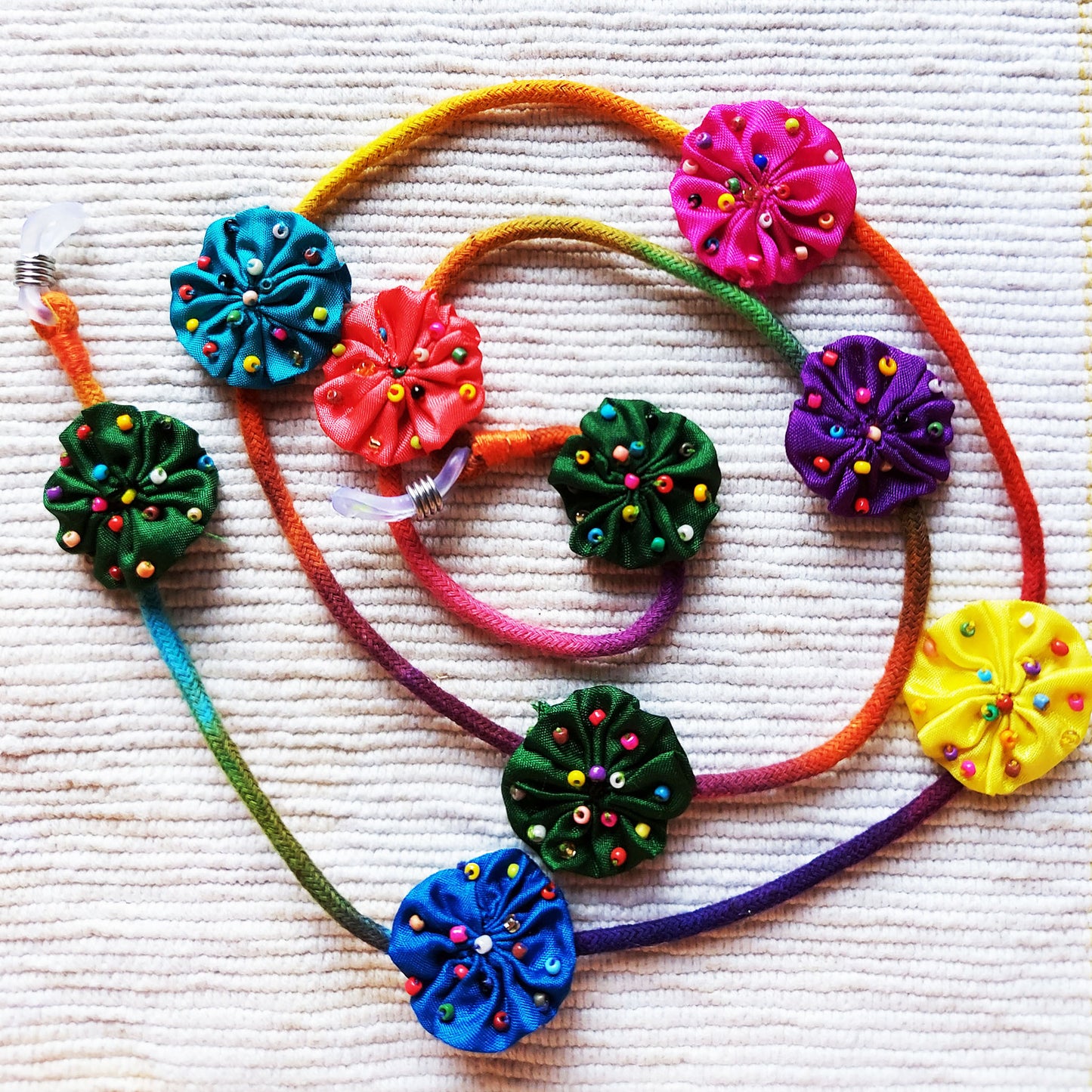 Beaded flower spectacle string